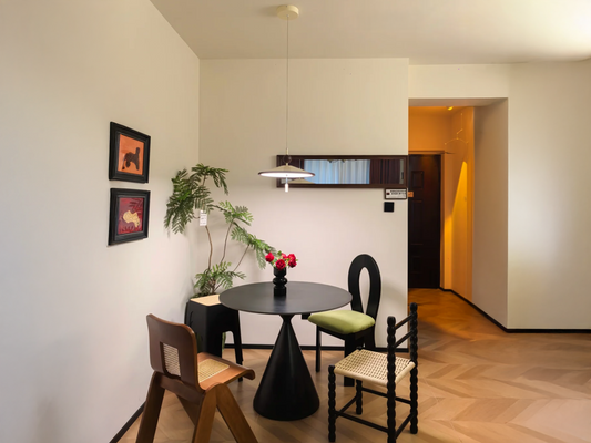 Designing a Minimalist Dining Corner with Pendant Lighting and Unique Dining Chairs