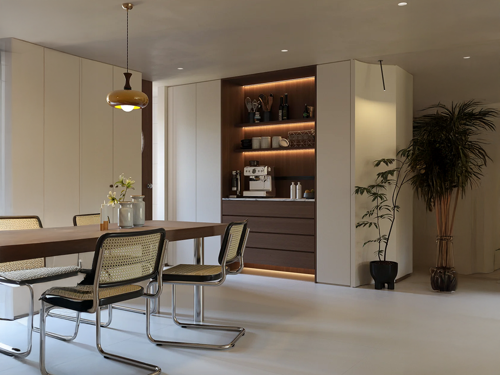 The Art of Balance: Cane Dining Chairs and Vintage Pendant Glow