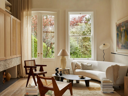 Natural Elegance: Curved Sofas and Cane Chairs in Harmony